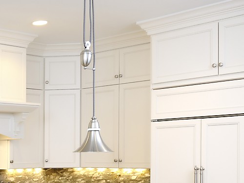 AFTER high cabinets stacked to the ceiling for storage