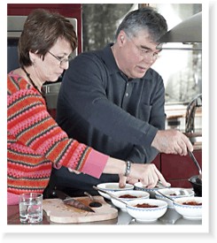 Ingrid and John prepare a lunch of Pasta Puttanesca for guests in their new kitchen.