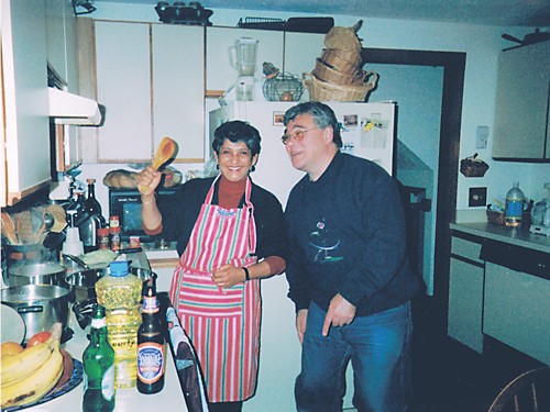 BEFORE A family friend kids around with John in the old kitchen.